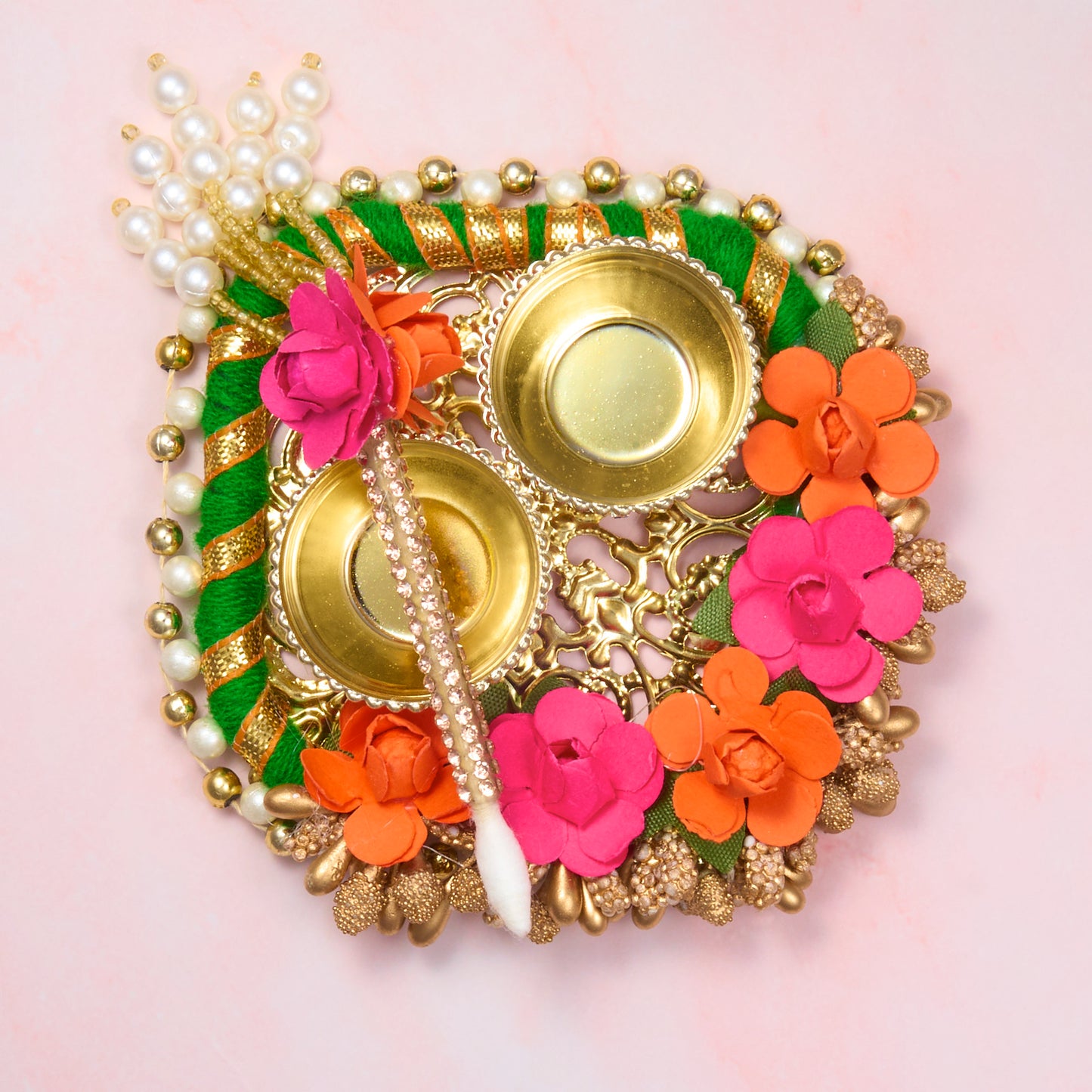 Compact floral roli chawal plate with tika stick. 2 holders for haldi, kumkum or rice – ideal for Rakhi, Diwali or pooja rituals, approx. 9cm wide