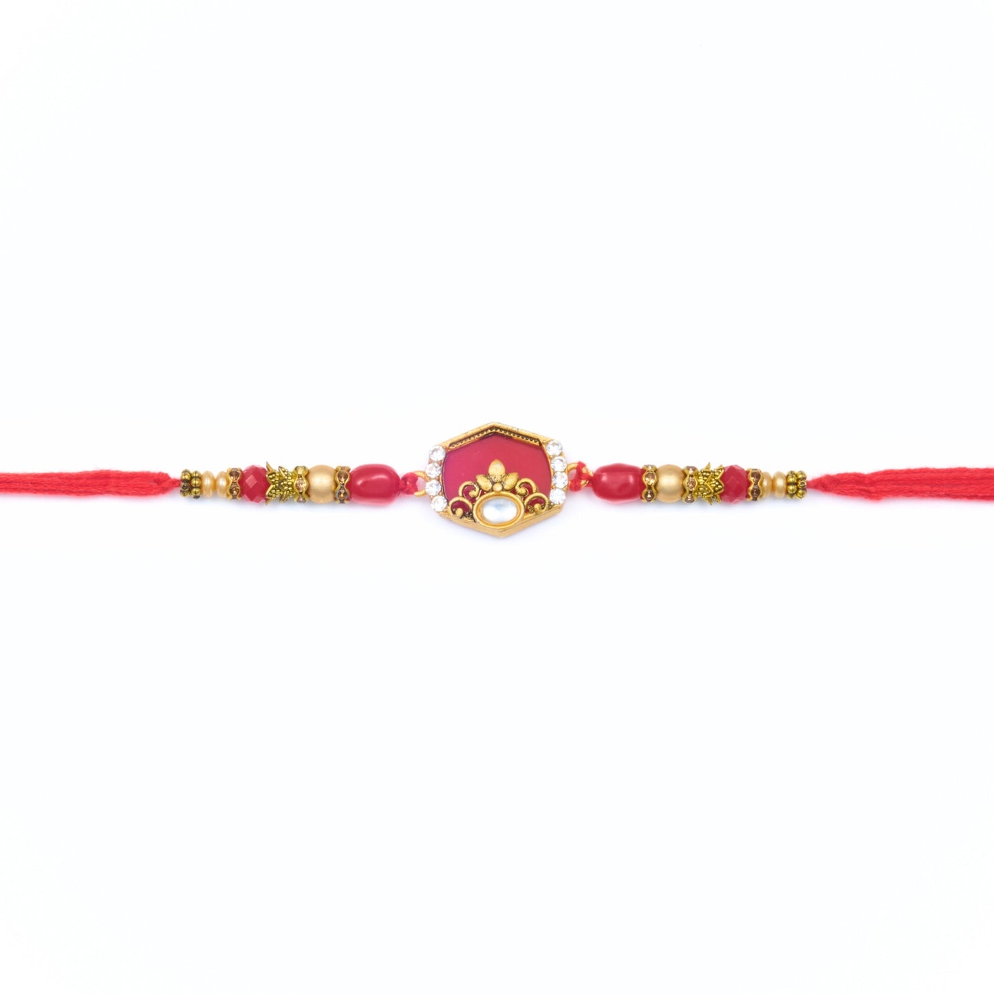Red kundan-style Rakhi with hexagon centre, gold beads and red thread – Rakhi gift for brother