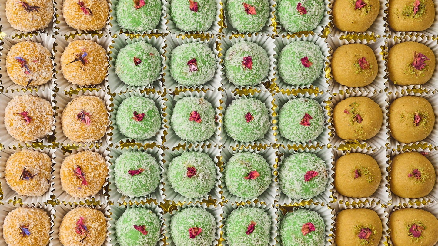 Assorted laddoo platter tray with coconut, gulkand nuts and besan laddoos for office events in Sydney