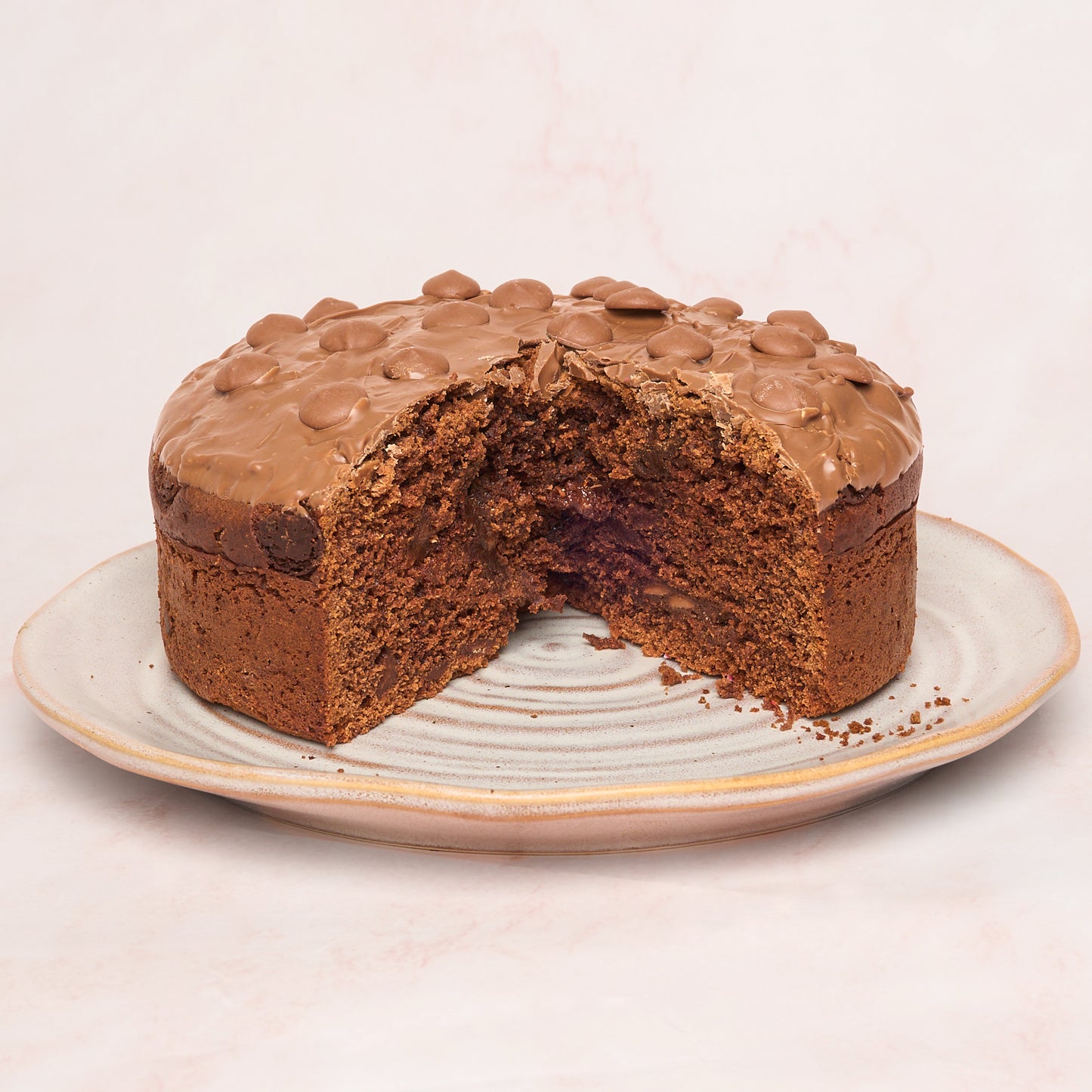 Slice of eggless chocolate cake showing slightly moist tea-cake texture