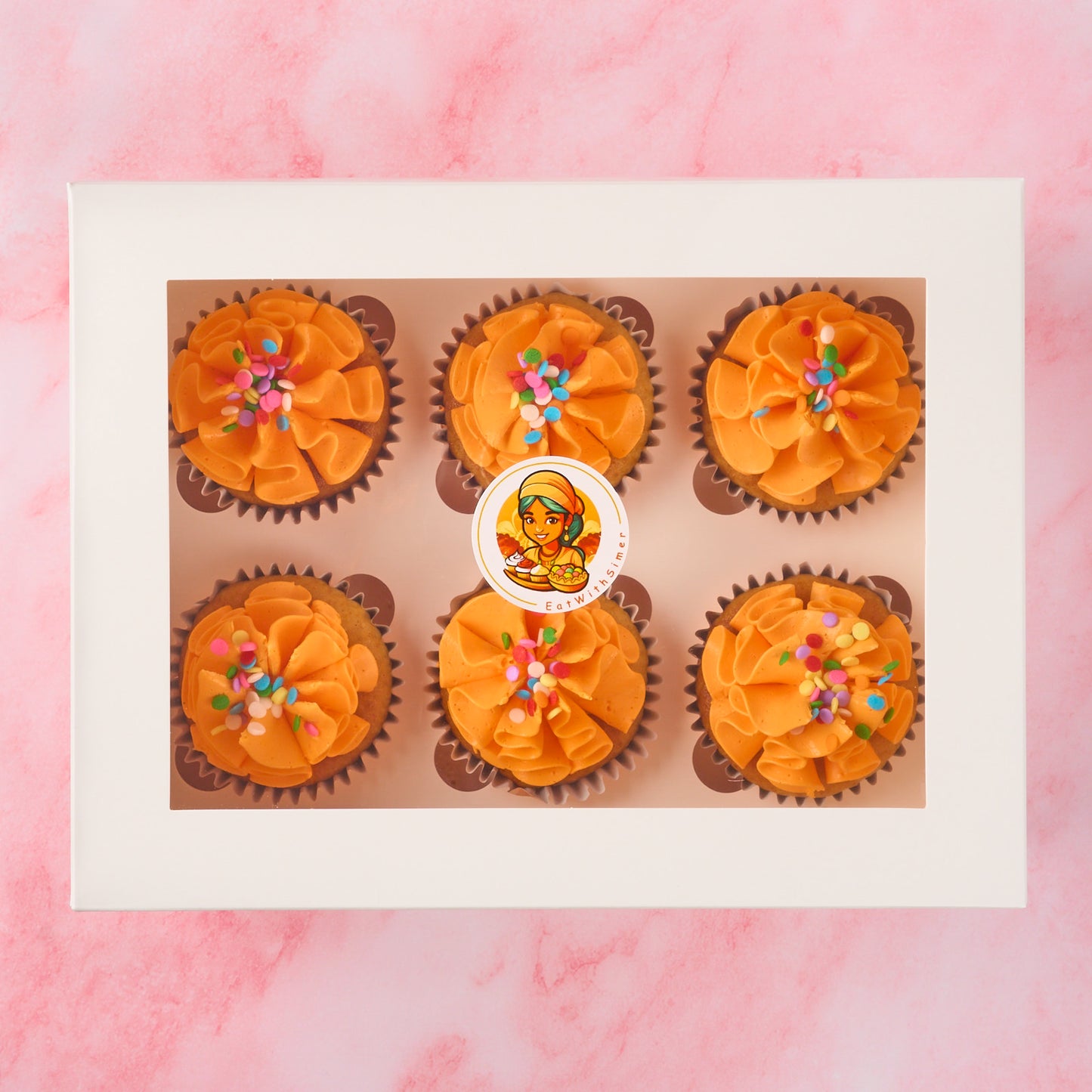 Eggless cupcakes in Sydney presented in a 6 piece box with vanilla buttercream and colourful sprinkles