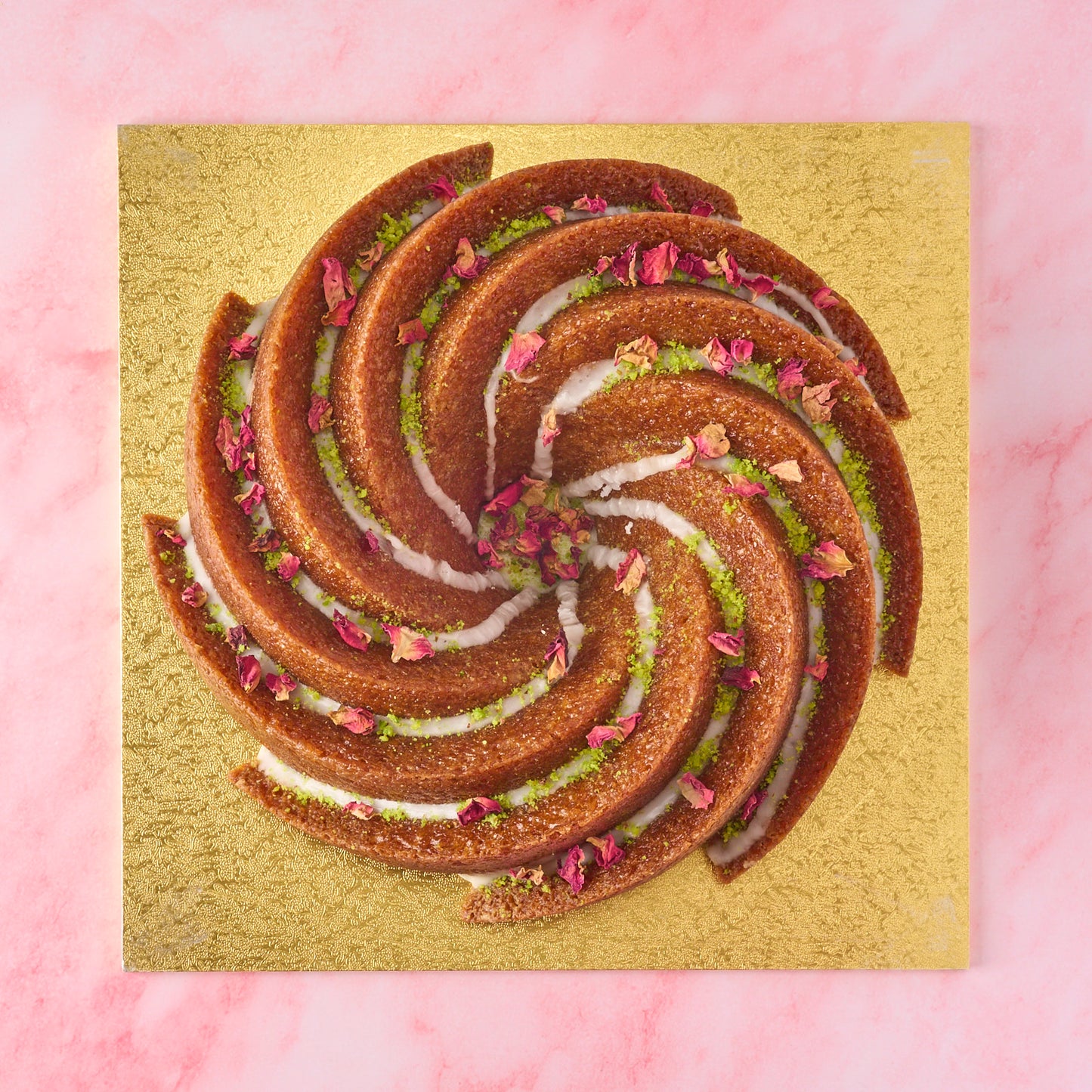 Top view of Gulab Jamun Cake with pistachio and rose petal finish, modern Indian sweet cake for birthdays and gifting in Sydney