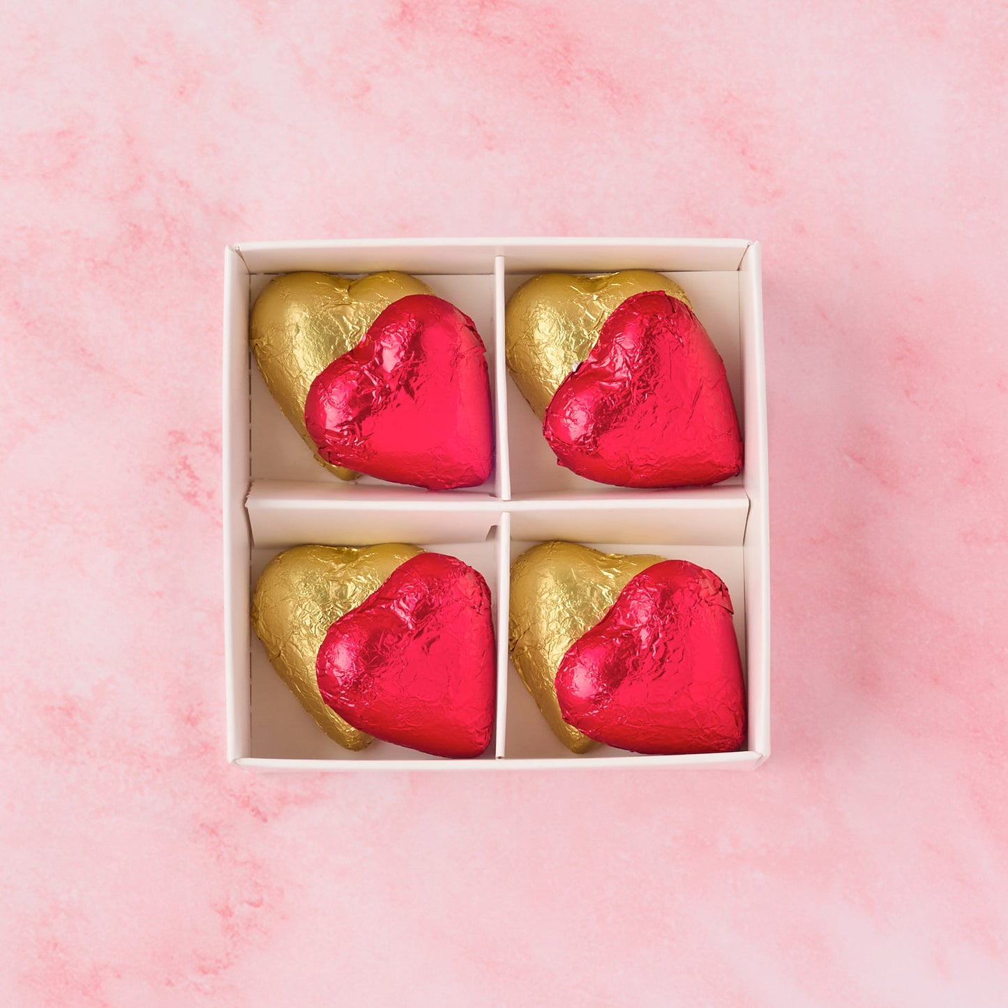 Open red and gold heart chocolate box showing 8 heart-shaped chocolates, premium chocolate gift box ideal for Valentine’s Day, anniversaries and dessert gifting