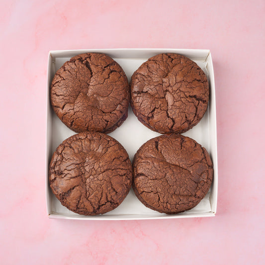 Soft and fudgy brownie cookies arranged neatly in a box