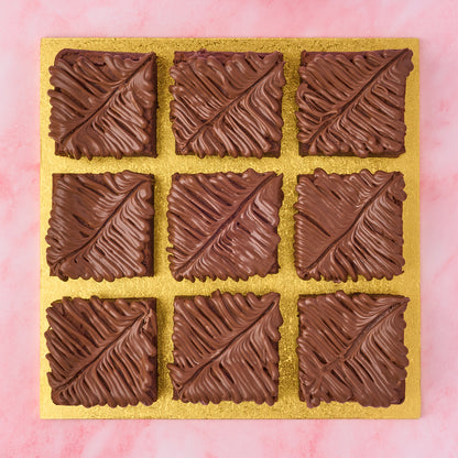  Chocolate Brownie Gift Box with 9 neatly decorated squares on a golden tray, perfect for gifting.