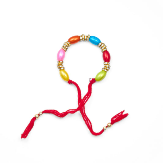 Bracelet Rakhi for Bhabhi with colourful oval beads and gold diamond spacers on red thread. Shipping from Sydney and Australia Wide Delivery