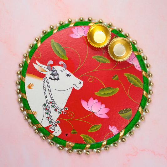 Pichwai-style Tika Tilak Pooja Thali with traditional red and green festive design, includes roli chawal holders. Perfect plate for festive gifting and sacred rituals pooja.