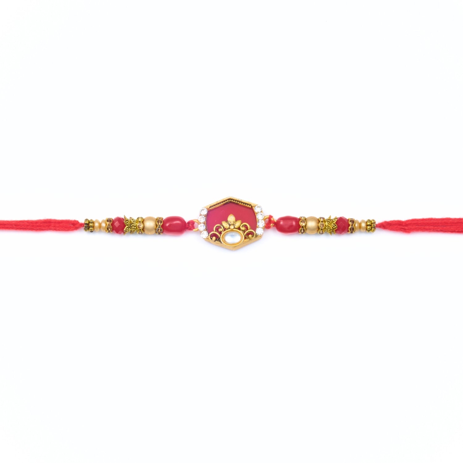 Red kundan-style Rakhi with hexagon centre, gold beads and red thread – Rakhi gift for brother
