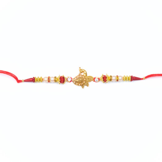 Peacock charm Rakhi with red and gold beadwork on red thread – Rakhi gift ideas for brother