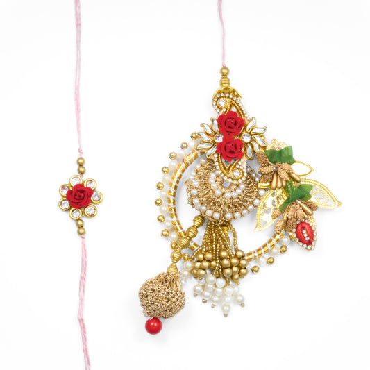 Red and gold floral Rakhi for bhai bhabhi with rose motifs, pearls, and lumba detailing – perfect for Raksha Bandhan gifting.