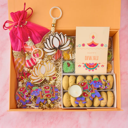 Amara Diwali gift box with large potli bag, laddoos, nankhatai, elephant tealight holder and wall hangings