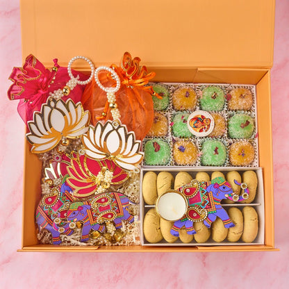 Amara Indian gift hamper with two potli bags, laddoos, nankhatai, elephant tealight holder and keepsake decor