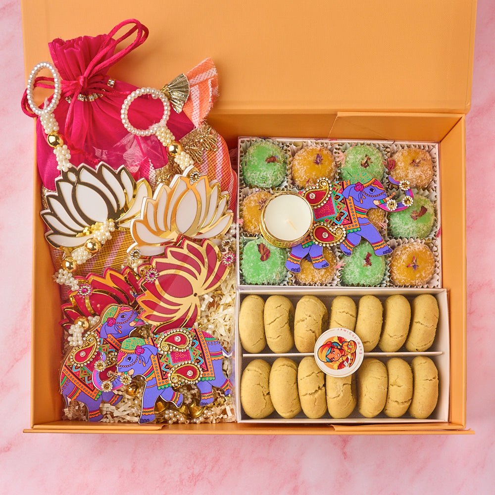 Amara premium Indian gift hamper with fresh laddoos, nankhatai, roasted nuts, potli bags and elephant decor