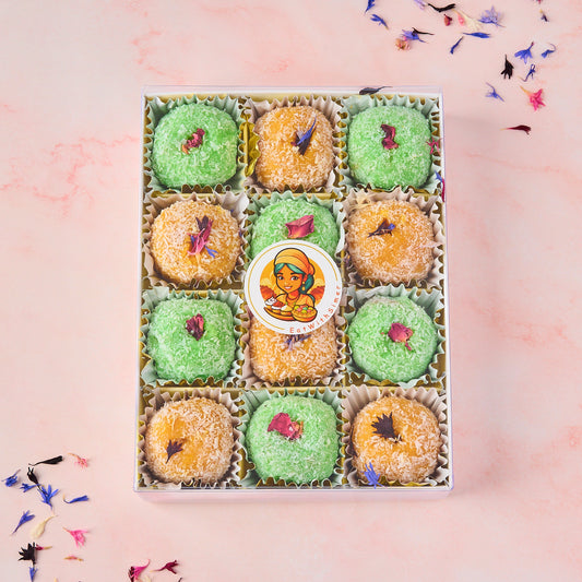 Assorted Coconut Laddoo Gift Box in Australia with Mango Coconut and Rose Gulkand Filled Laddoos in a 12 piece transparent lid box
