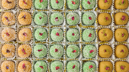 Assorted laddoo platter tray with coconut, gulkand nuts and besan laddoos for office events in Sydney