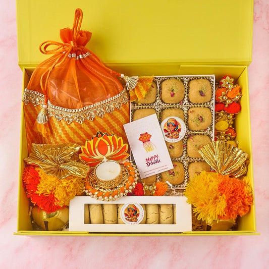 Blossom Bliss Diwali hamper with Besan Laddoos, nankhatai, roasted nuts, lotus diya and wall hangings