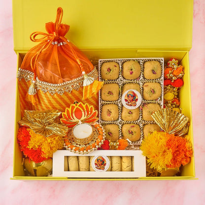 Blossom Bliss gift hamper with potli bags, Besan Laddoos, nankhatai, roasted nuts and tealight holder