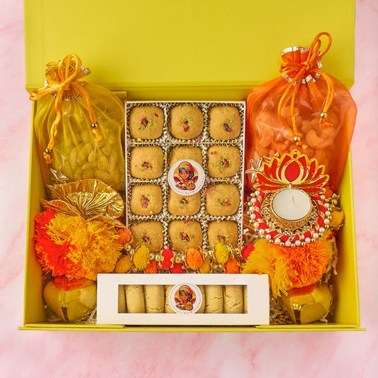 Blossom Bliss Indian gift hamper with Besan Laddoos, nankhatai, roasted nuts, tealight holder and yellow keepsake box