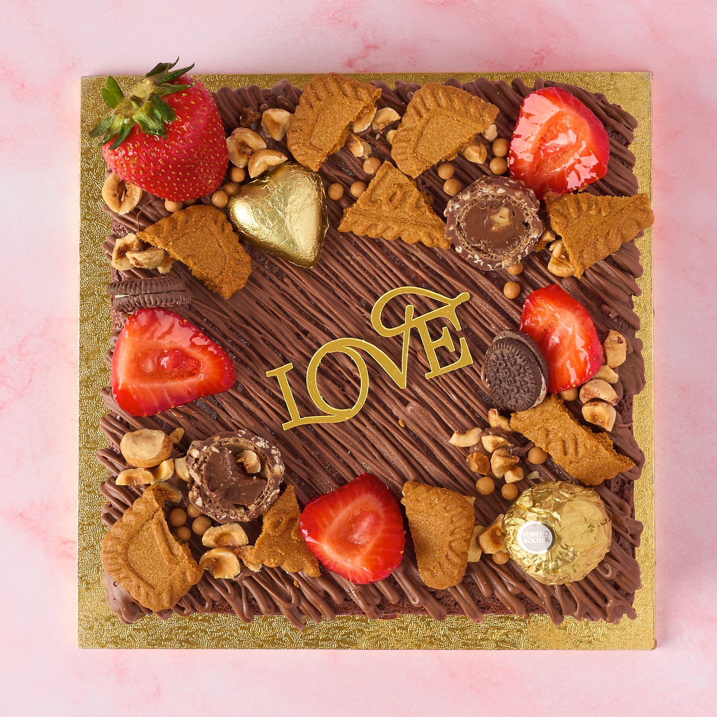 Brownie cake made with real Belgian chocolate, eggless and fresh, topped with strawberries, chocolates and Love cake charm, perfect Valentines Gift