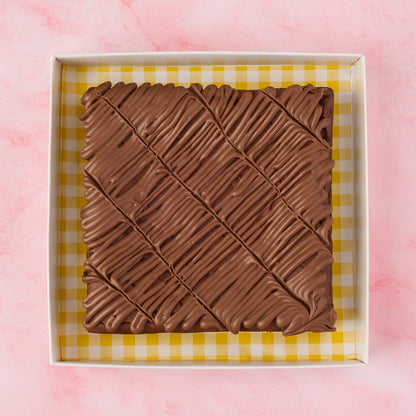 Eggless chocolate brownie slab made with real Belgian chocolate, shown sliced in an open box