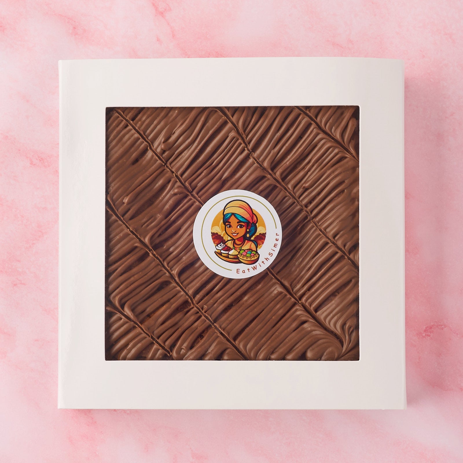 Whole eggless chocolate brownie slab in white gift box with window, made using Belgian chocolate