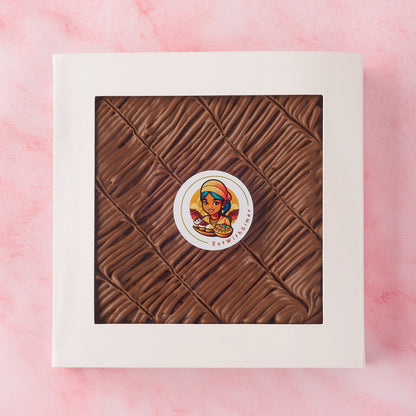 Whole eggless chocolate brownie slab in white gift box with window, made using Belgian chocolate