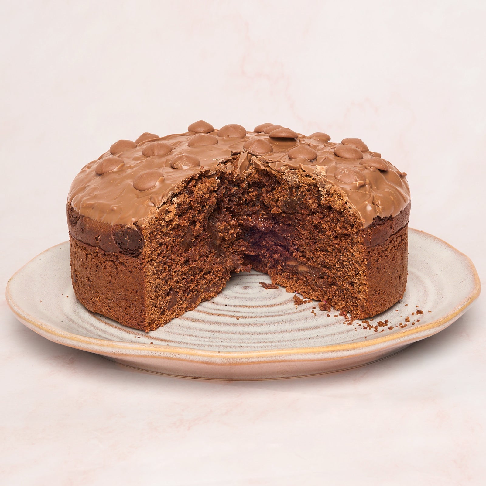 Slice of eggless chocolate cake showing slightly moist tea-cake texture