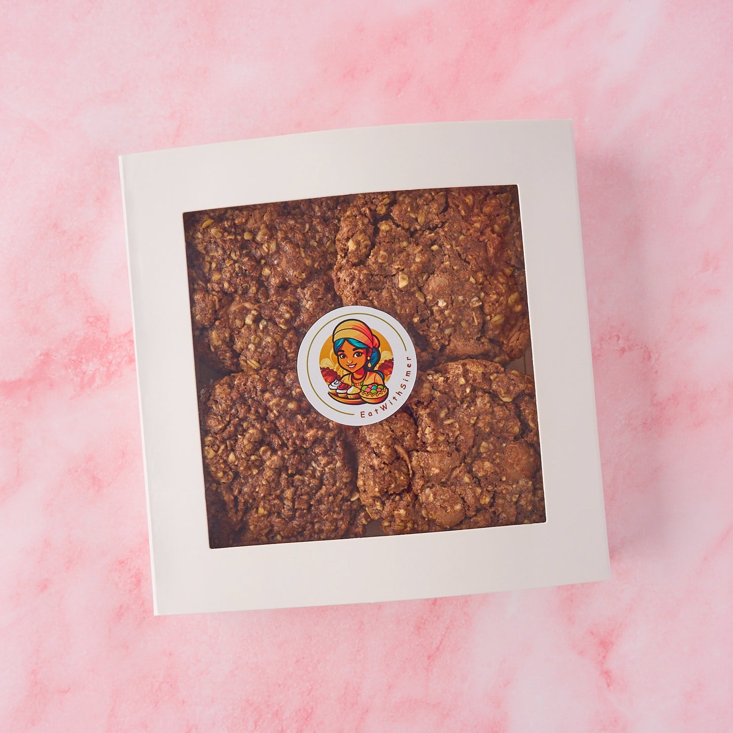 Chocolate oat cookies in a neatly packed gift box with window packaging