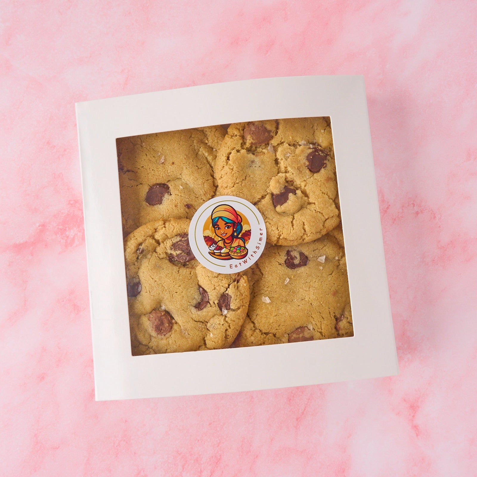 Eggless choco chip cookies in an 8 piece box with crisp edges and soft centre