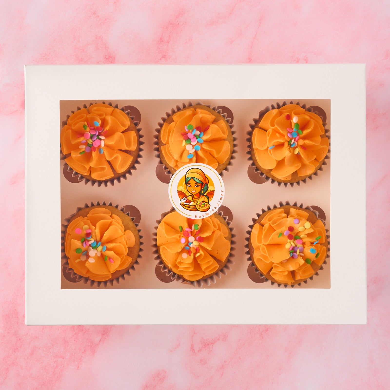 Eggless cupcakes in Sydney presented in a 6 piece box with vanilla buttercream and colourful sprinkles