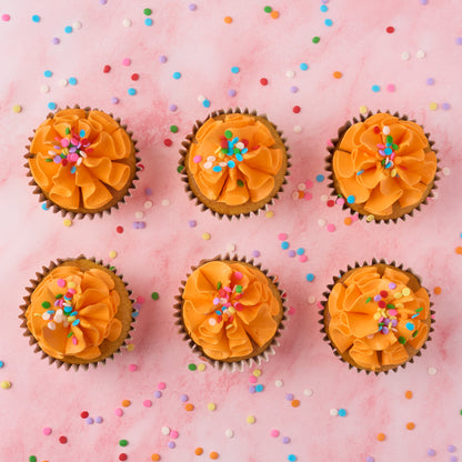 Eggless vanilla cupcakes topped with real buttercream and sprinkles, baked fresh in Sydney