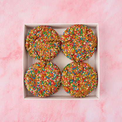 Open box of funfetti cookies showing colourful sprinkle-covered eggless cookies