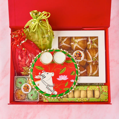 Indian gift hamper Gauhar with premium sweets, roasted nuts, potli bags and large tealight holder