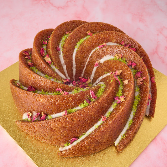 Gulab Jamun Cake in Sydney with spiral design, pistachio and rose petals, modern Indian sweet cake and eggless celebration cake