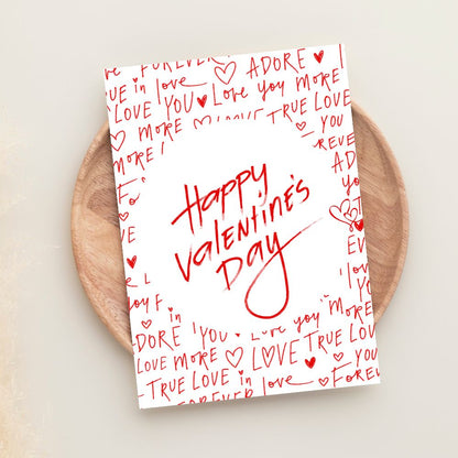Valentine’s Day greeting card with handwritten love notes and romantic red design