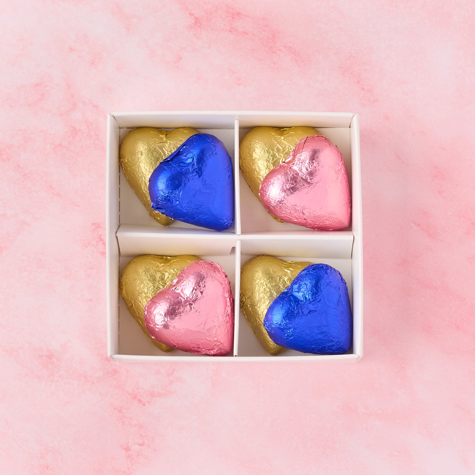 Open pink and blue heart chocolate box with 8 heart-shaped chocolates, gender reveal chocolate gift box ideal for baby announcements and party favours