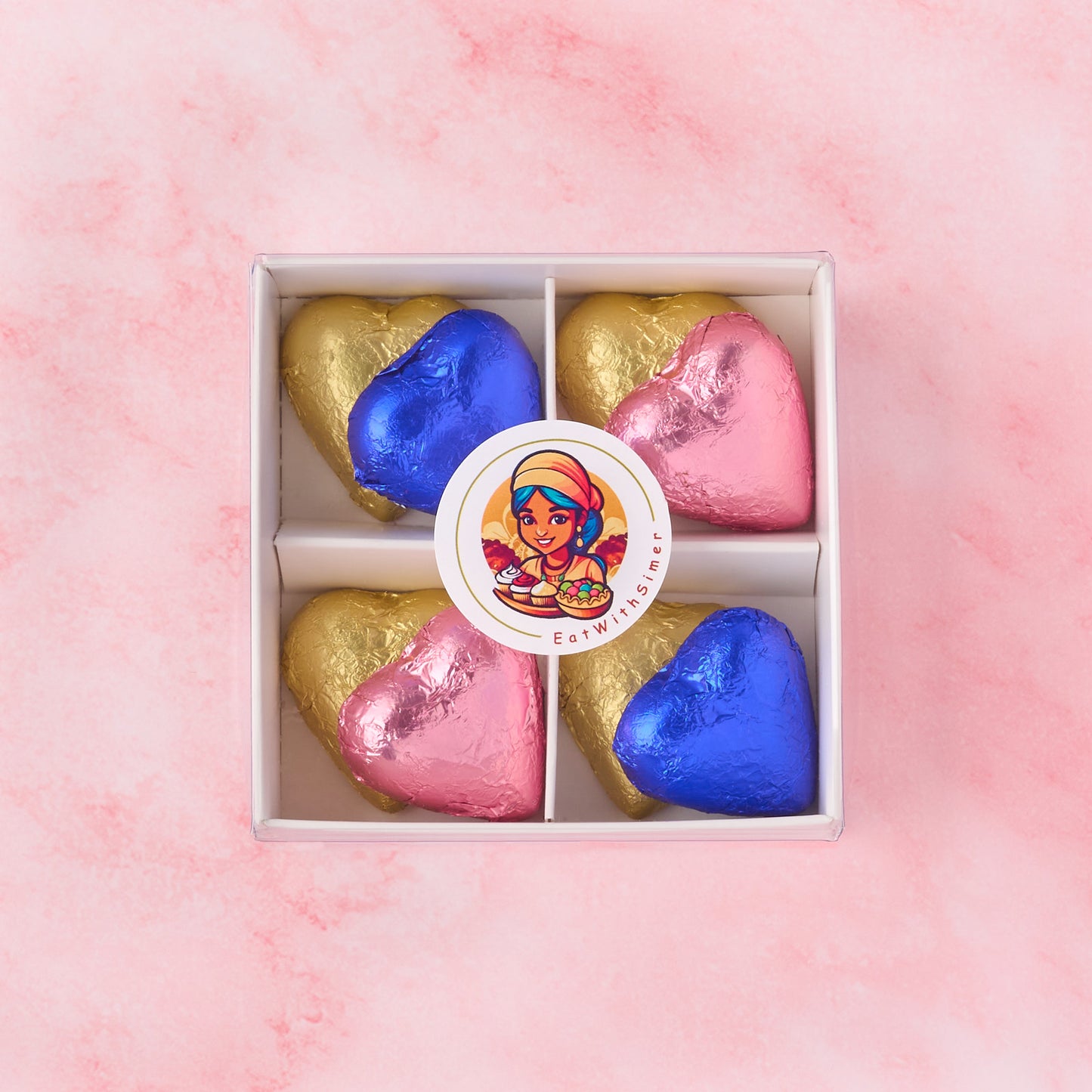 Pink and blue heart chocolate box with gold heart chocolates in a white gift box, gender reveal chocolate gift suitable for baby shower celebrations