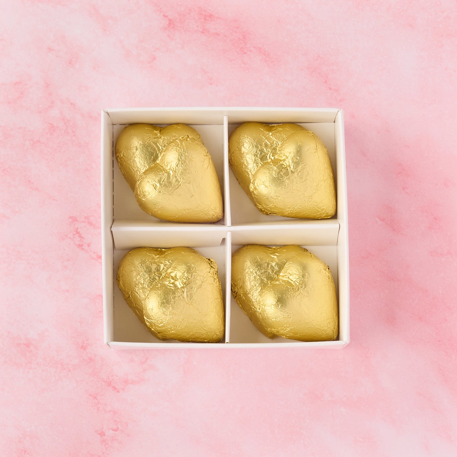 Open gold heart chocolate box displaying 8 heart-shaped chocolates, elegant chocolate gift box ideal for wedding favours, festive hampers and celebrations