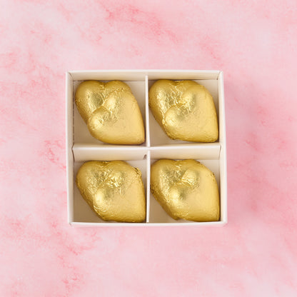 Open gold heart chocolate box displaying 8 heart-shaped chocolates, elegant chocolate gift box ideal for wedding favours, festive hampers and celebrations