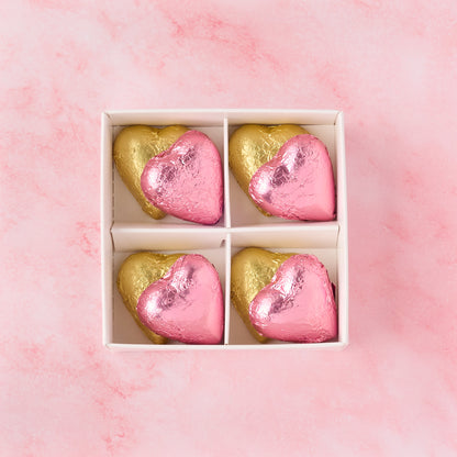 Open pink and gold heart chocolate box displaying 8 heart-shaped chocolates, chocolate gift box ideal for baby girl showers, return gifts and celebrations