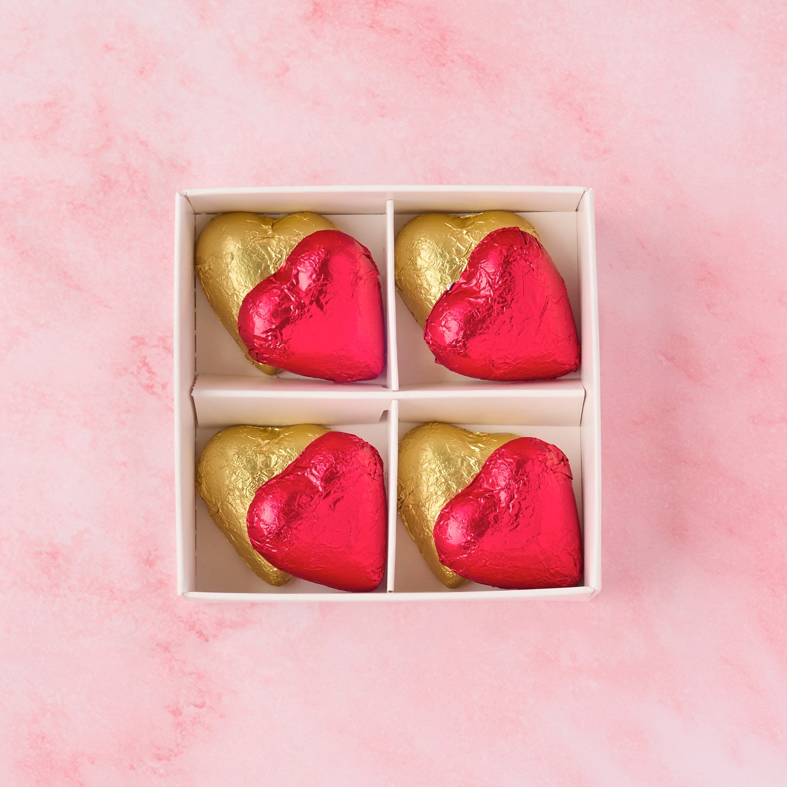 Open red and gold heart chocolate box showing 8 heart-shaped chocolates, premium chocolate gift box ideal for Valentine’s Day, anniversaries and dessert gifting