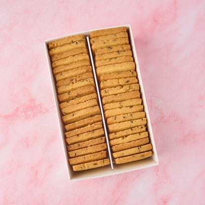 Open box of jeera biscuits showing neatly arranged eggless Indian savoury tea biscuits