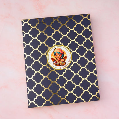 Dark blue gift box with gold pattern and EatWithSimer logo