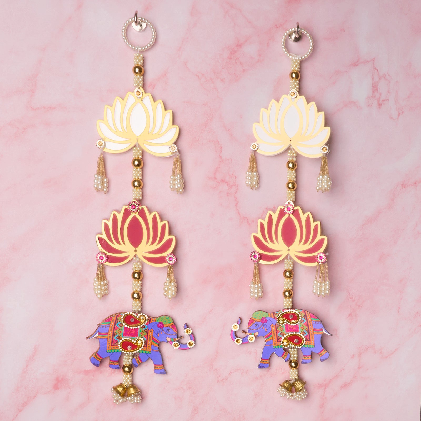 Lotus and elephant wall hangings with gold, pearl and colourful Indian decorative details