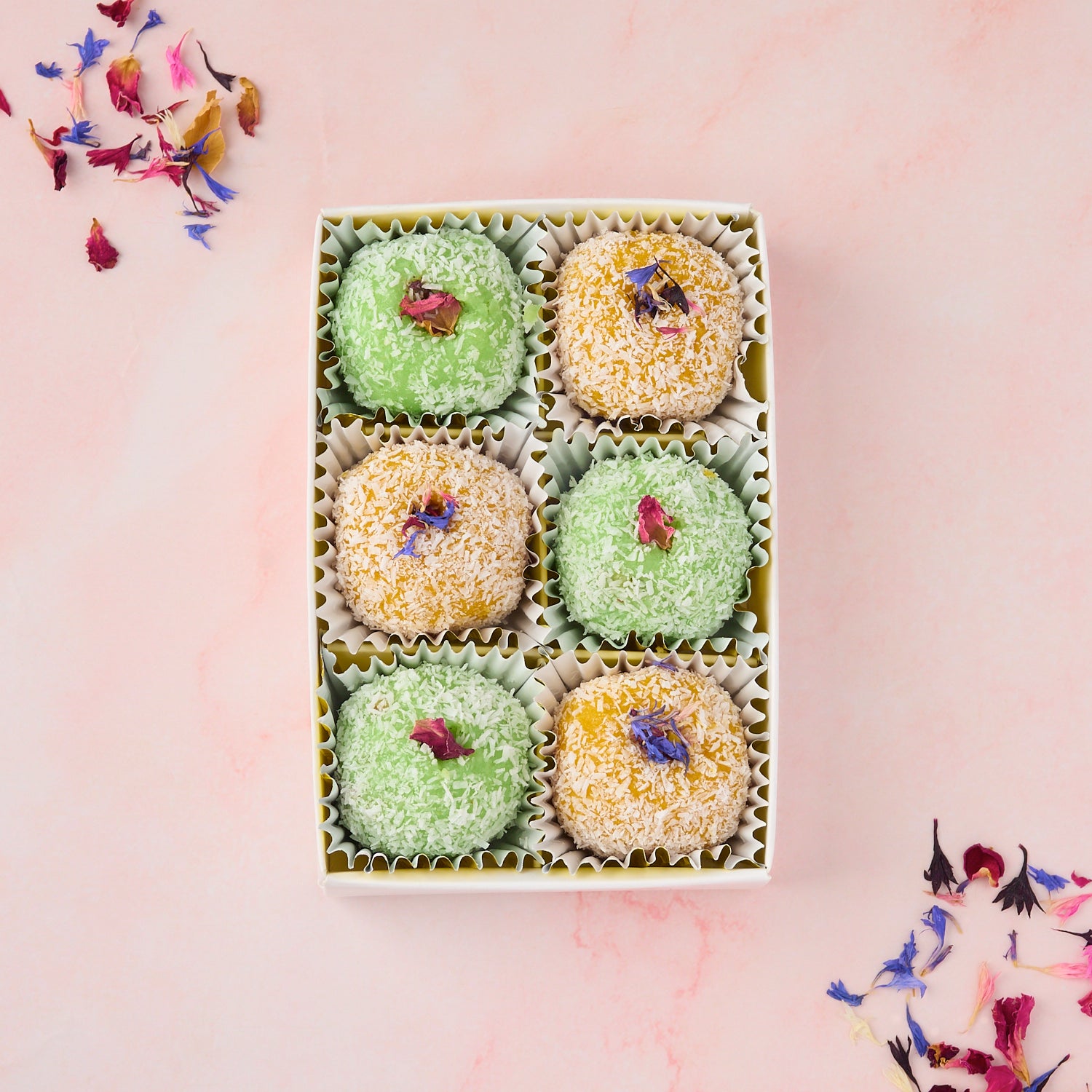 Open Mango Coconut and Rose Gulkand Coconut laddoo return gift box 6 Pc showing mixed flavour coconut laddoos in transparent lid event sweet box