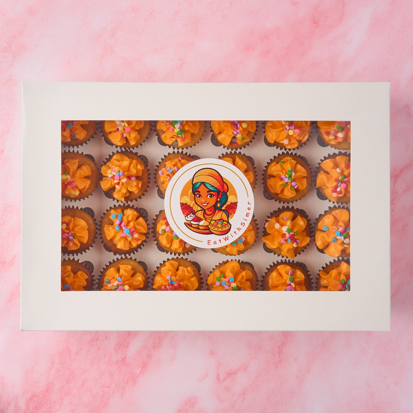 Mini eggless cupcakes presented in a box with vanilla buttercream frosting, suitable for kids parties and group celebrations in Sydney