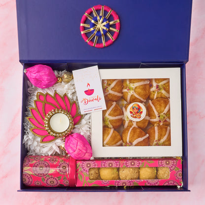 Padma Diwali hamper with Mini Gulab Jamun Cakes, besan laddoos, pinnis, lotus tealight holder, Diwali card and pink lotus wall hangings