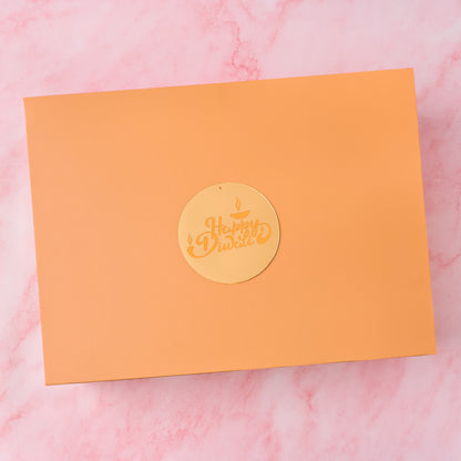 Peach Diwali gift box with gold acrylic Happy Diwali charm