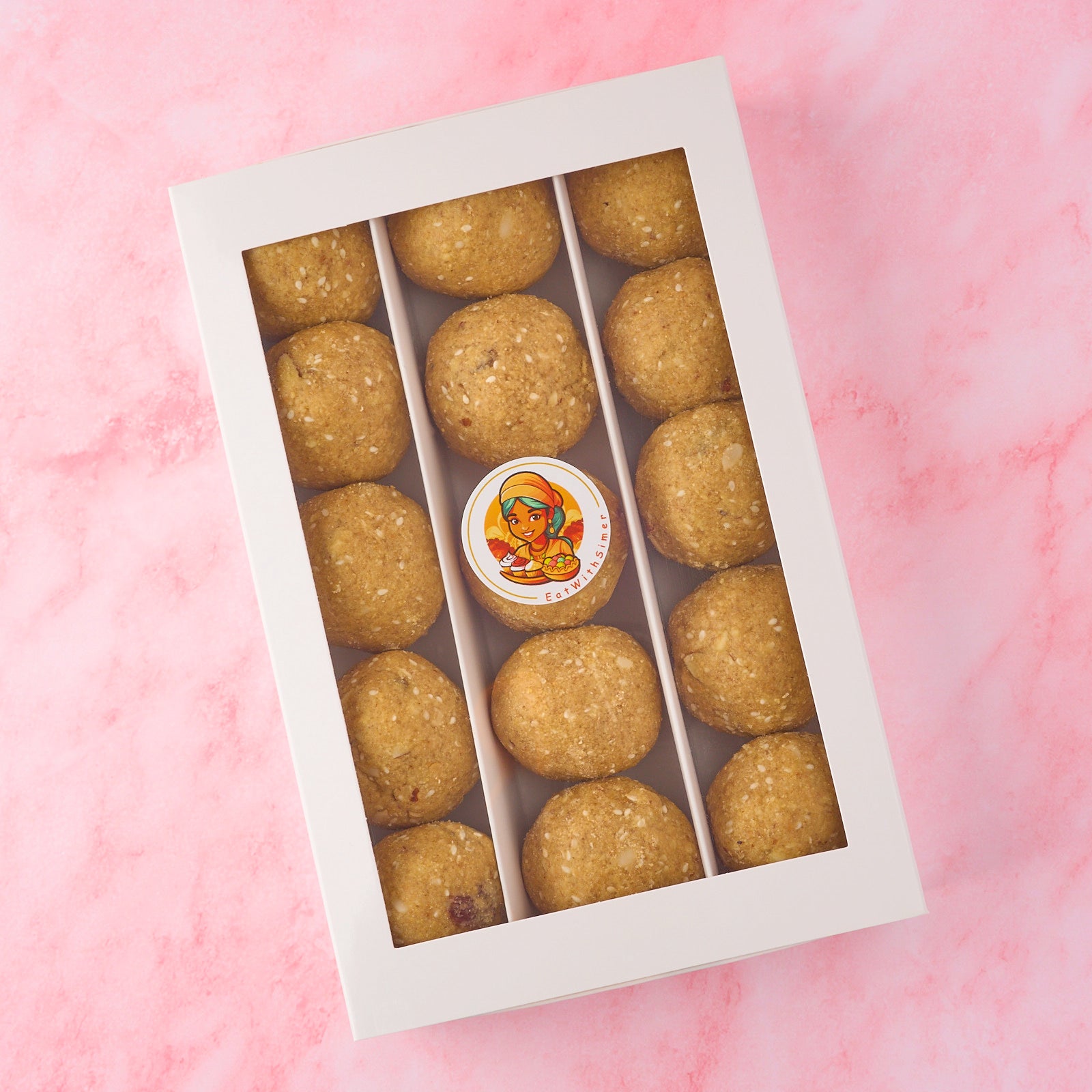 Premium Punjabi atta pinni box filled with khoya and dry fruit pinni for traditional sweet gifting and self consumption