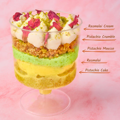 Rasmalai pistachio trifle cup showing layered pistachio cake, rasmalai, pistachio mousse, crumble and rasmalai cream in a clear dessert cup